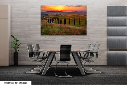 a dining room table with chairs and a painting on the wall