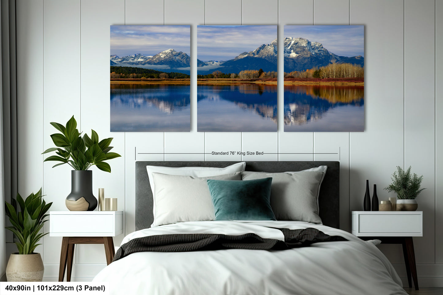 a bedroom with a large bed and two paintings on the wall
