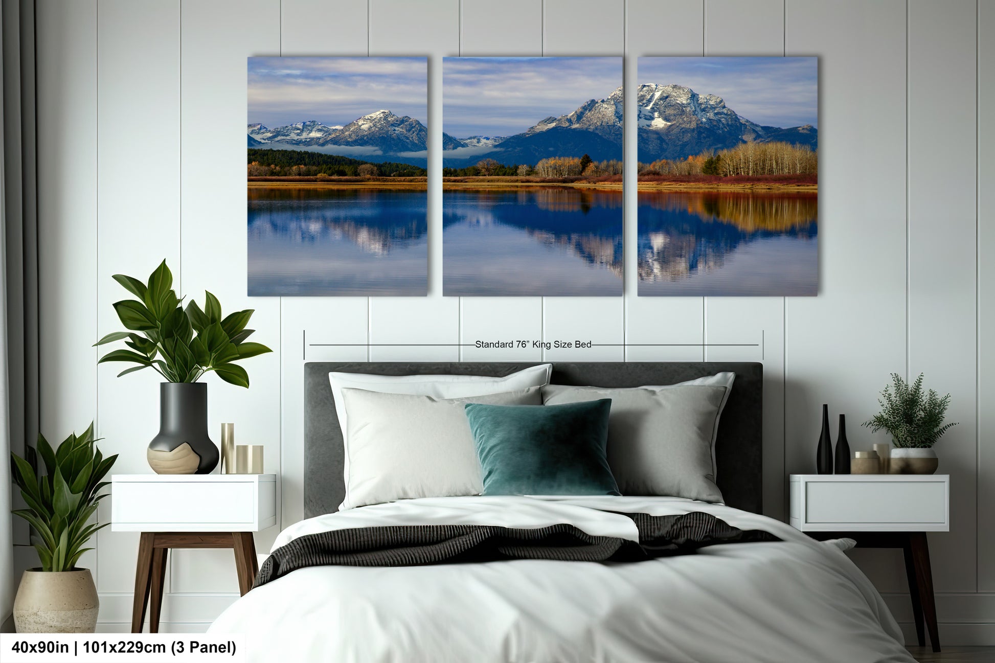 a bedroom with a large bed and two paintings on the wall