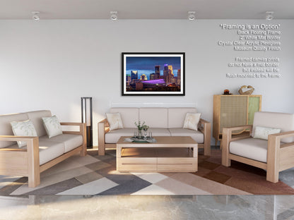 a living room filled with furniture and a painting on the wall
