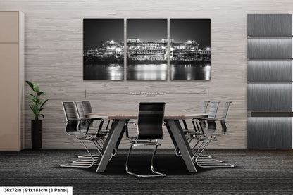 a black and white photo of a city at night