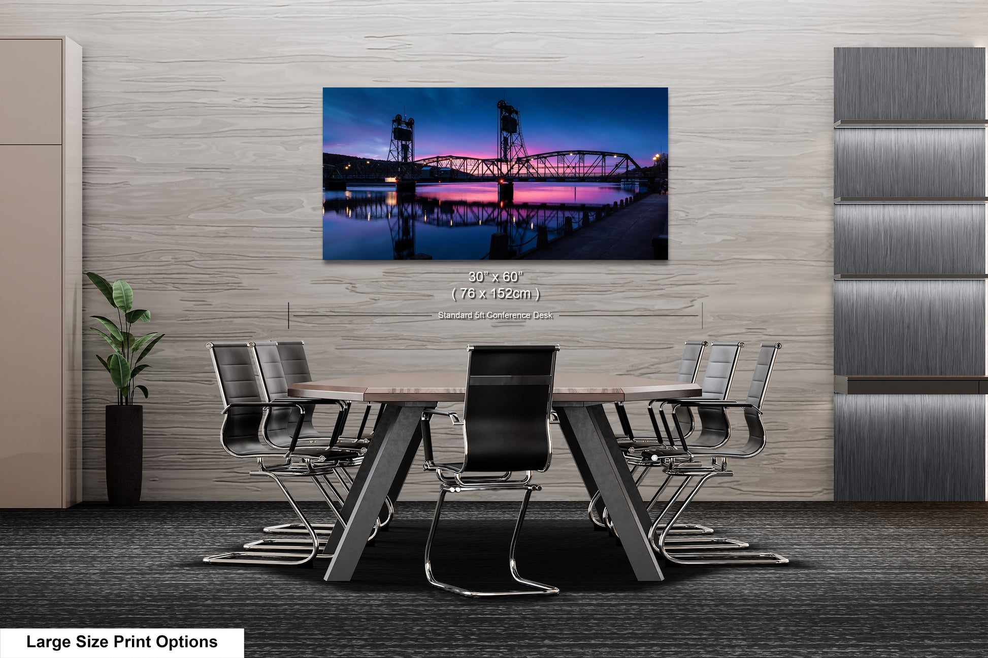 a dining room table with a painting of a bridge in the background