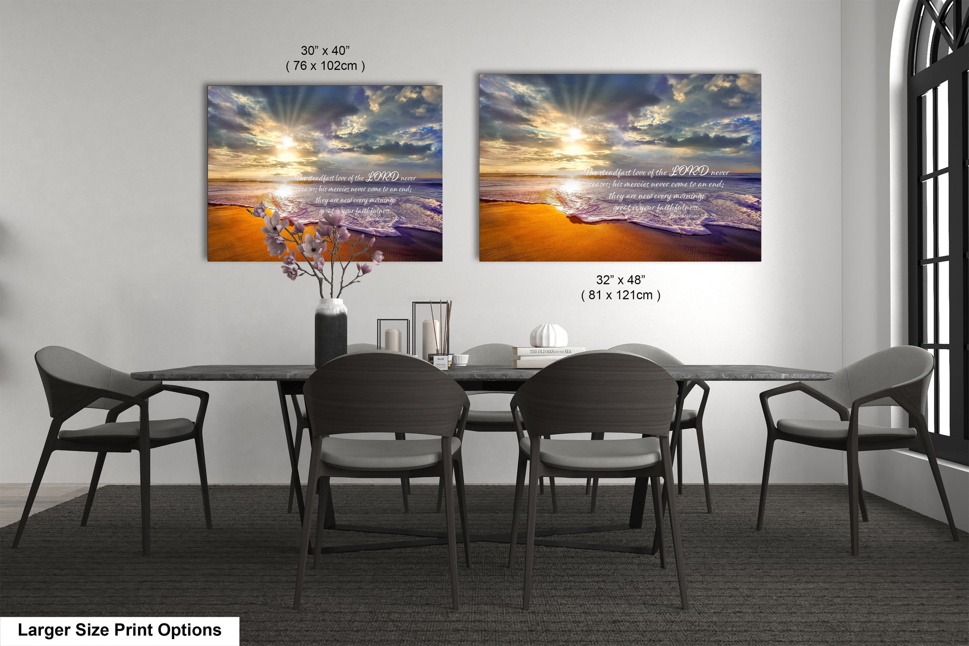a dining room table with four chairs and two pictures on the wall