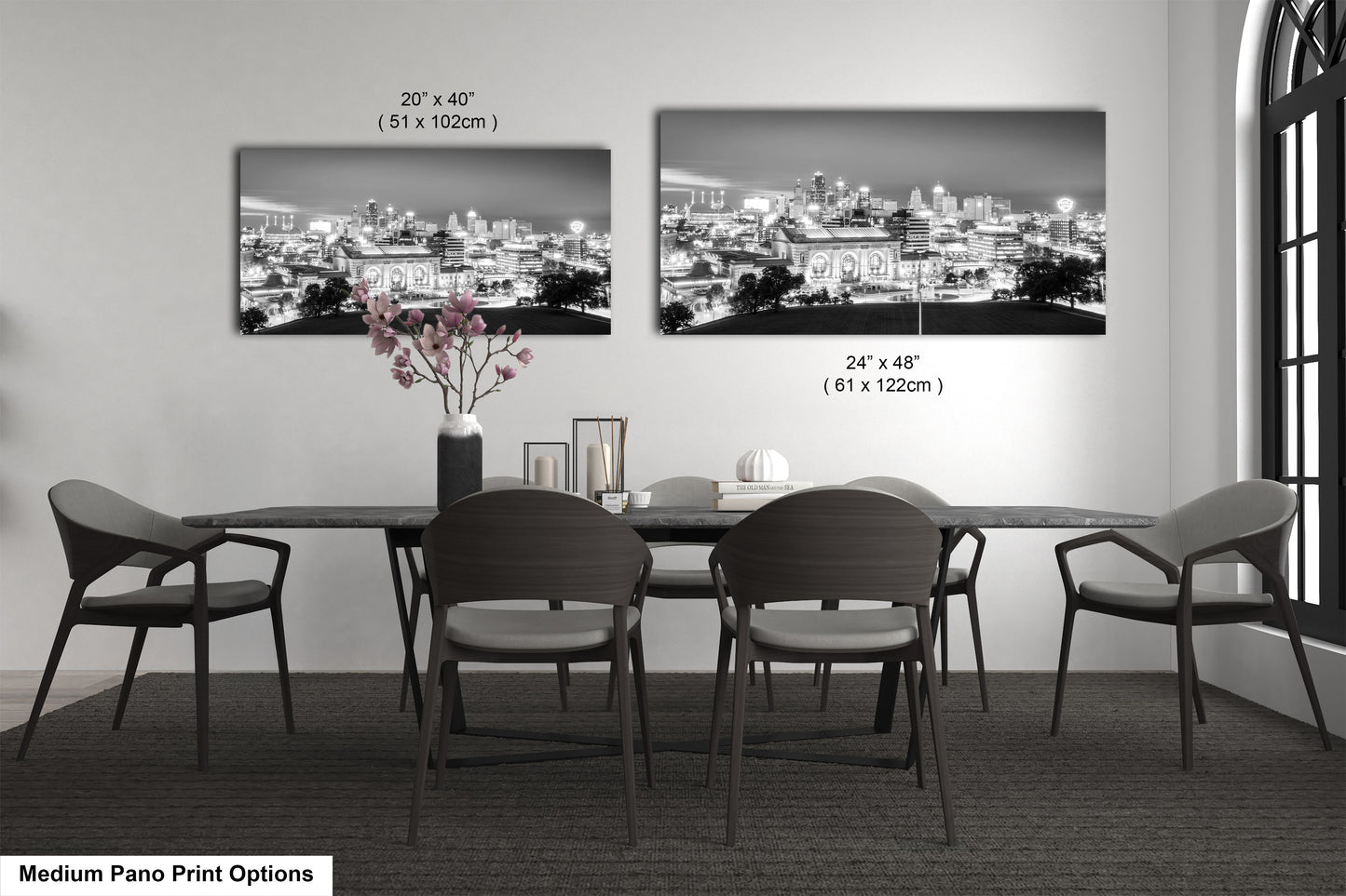 a black and white photo of a dining room table