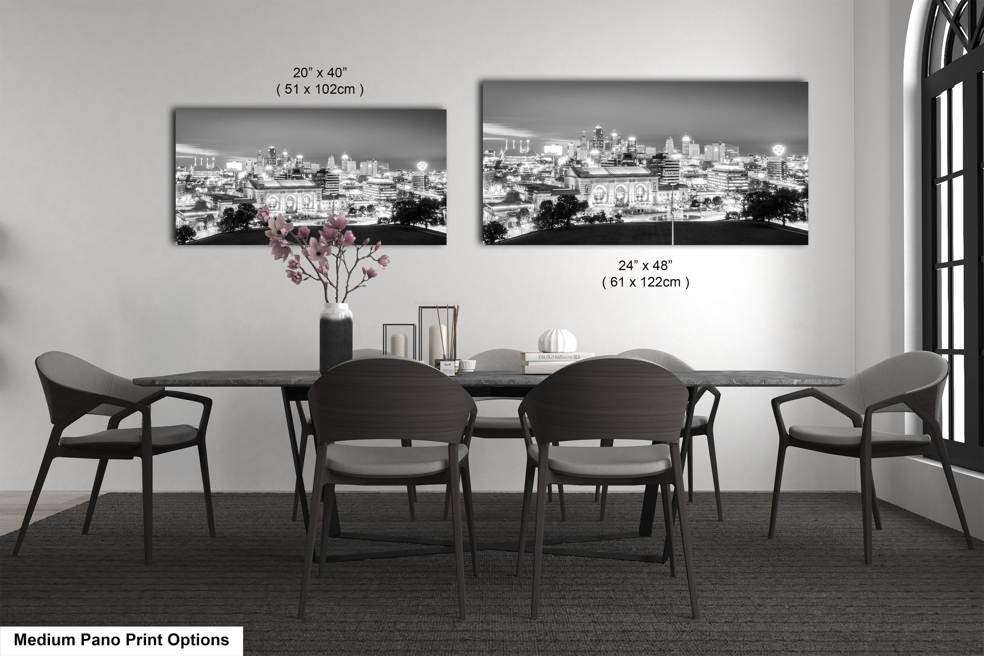 a black and white photo of a dining room table