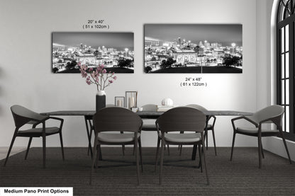 a black and white photo of a dining room table