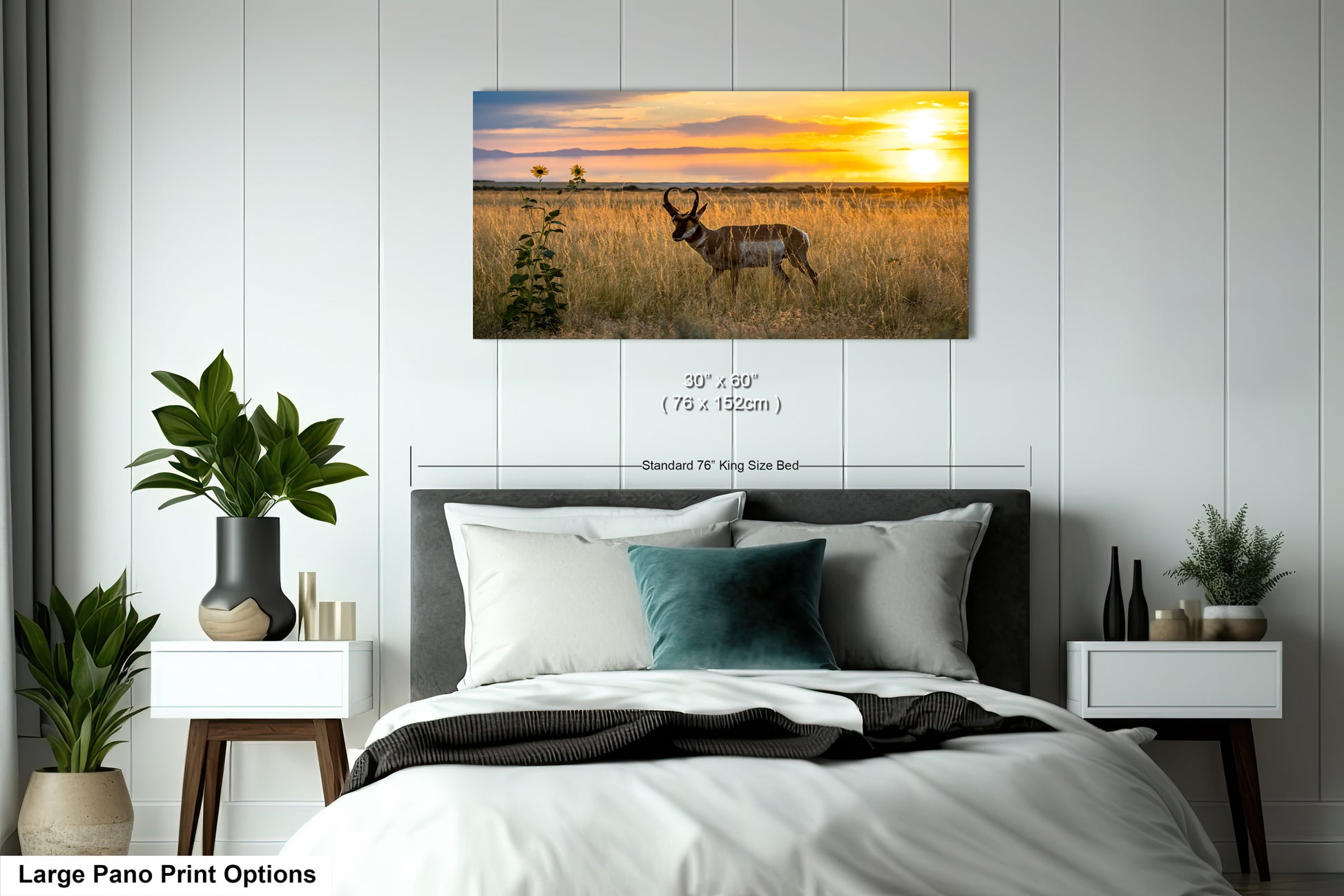 A large pano print depicting a sunset over a field with a gazelle in the foreground.