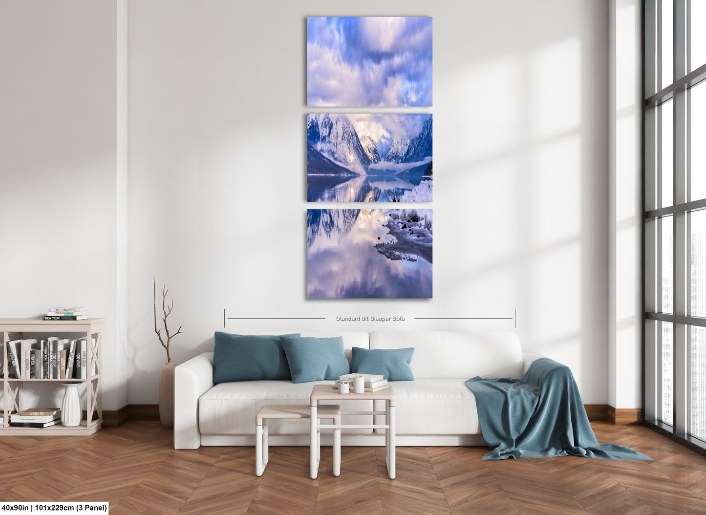 a living room with a white couch and a painting on the wall