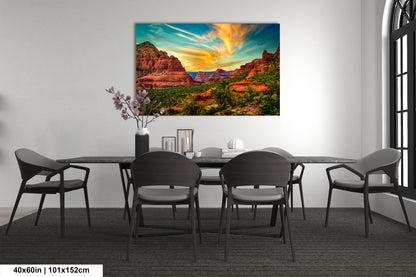 a dining room table with chairs and a painting on the wall