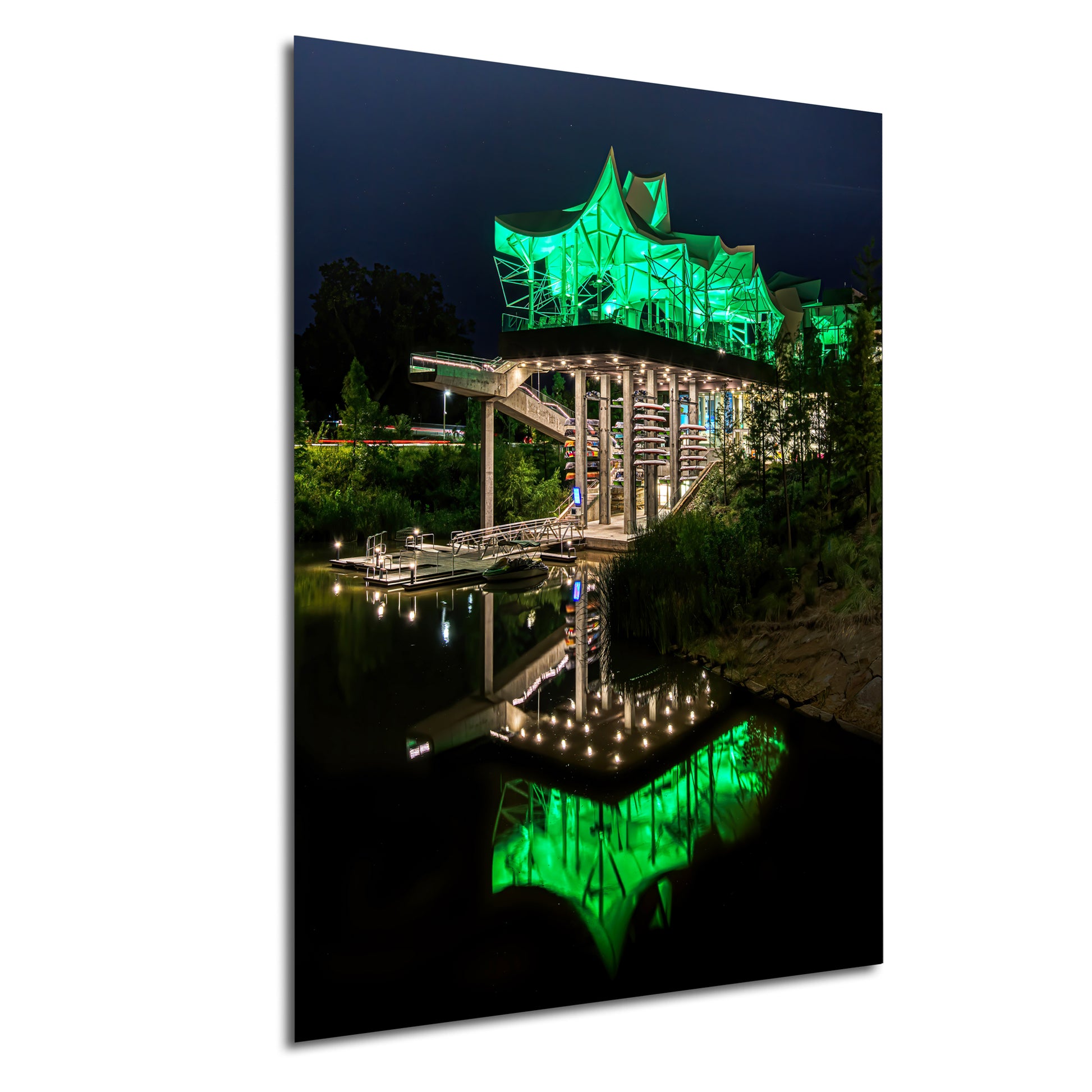 a lit up bridge over a body of water