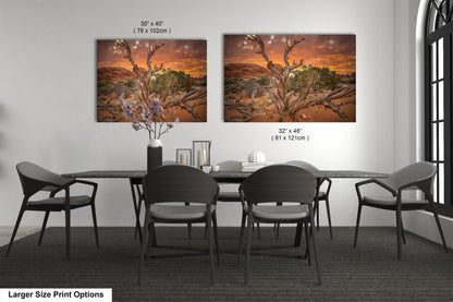 a dining room table with four chairs and a painting on the wall