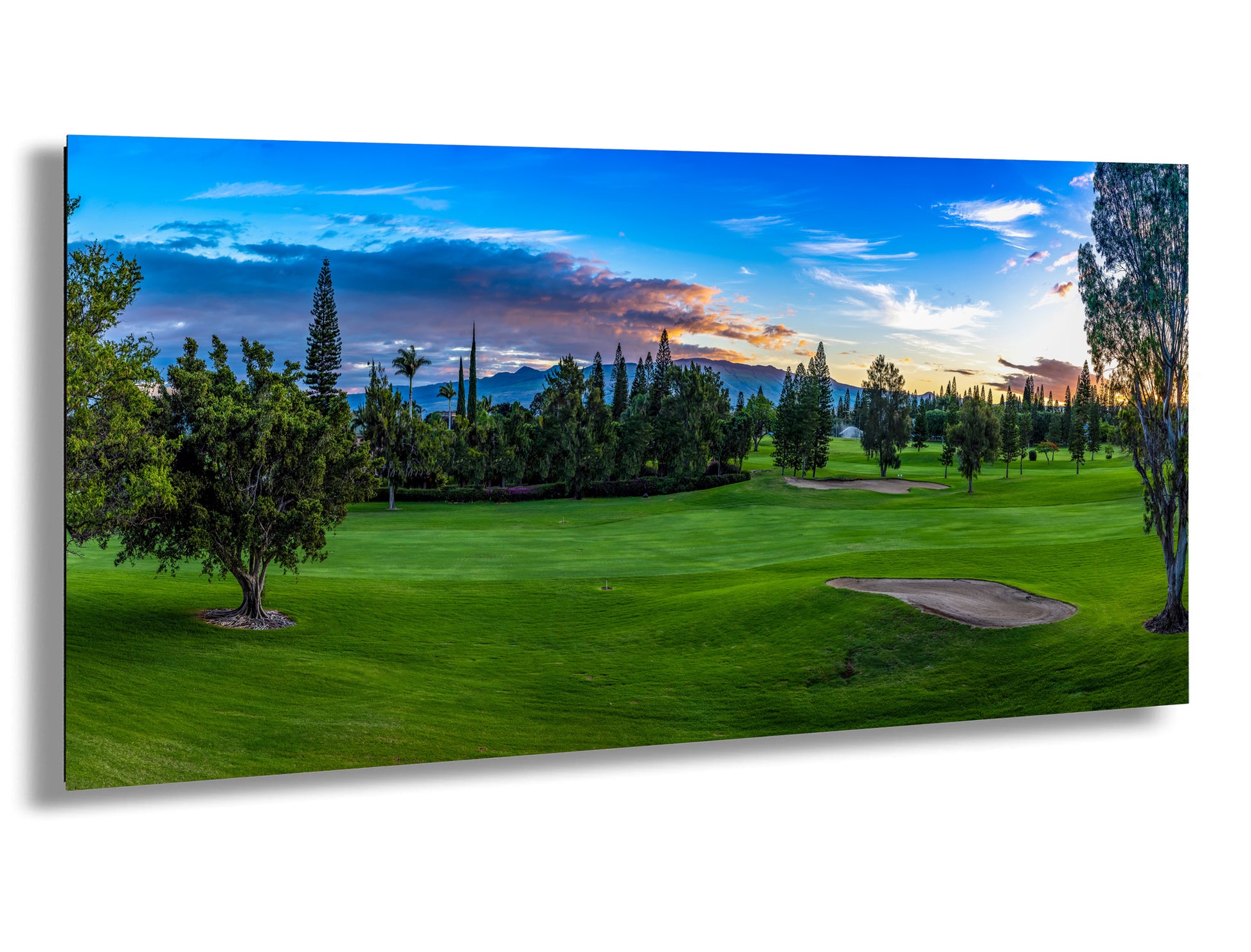 a painting of a golf course at sunset