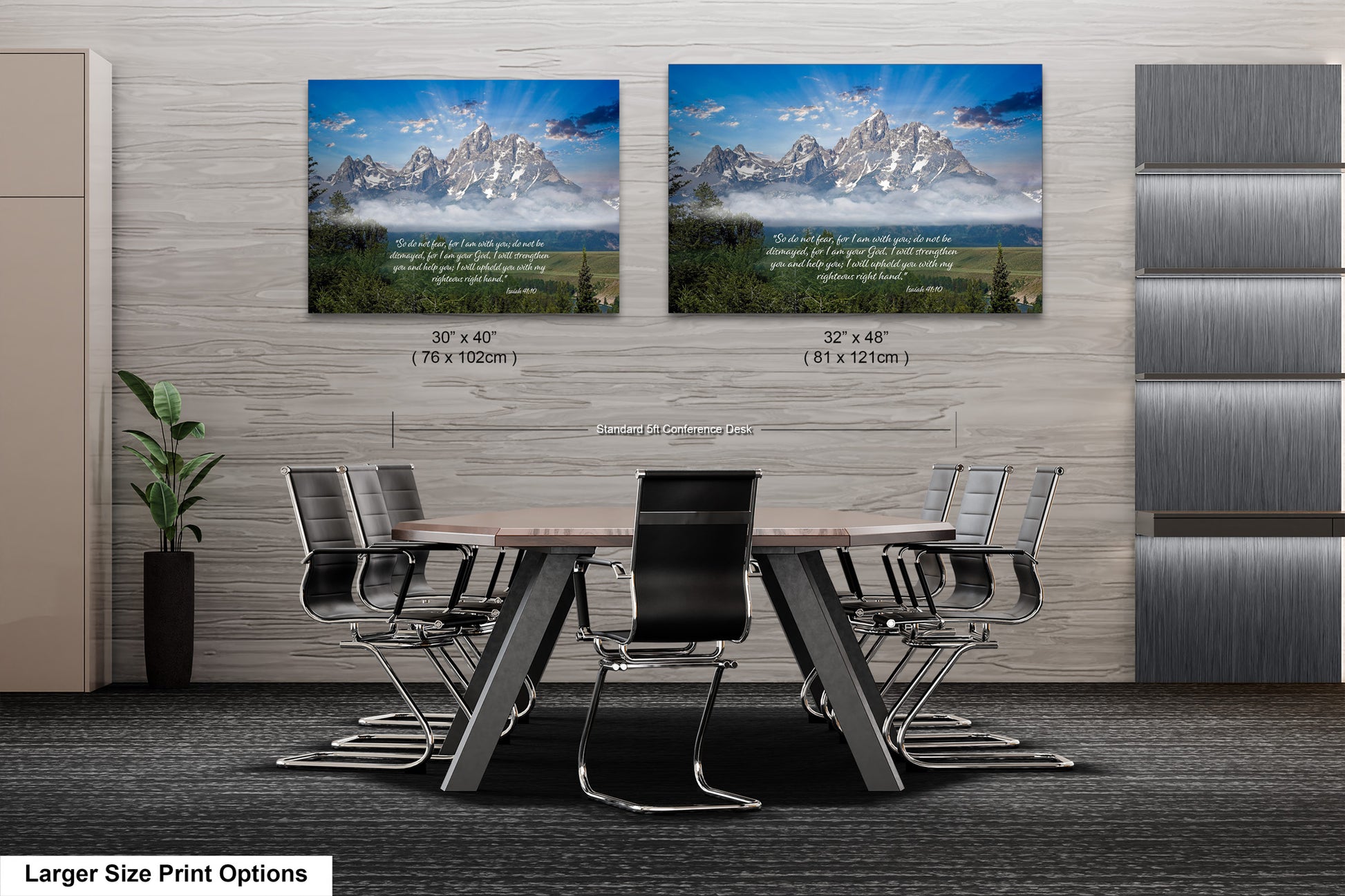 a dining room table with chairs in front of two pictures of mountains