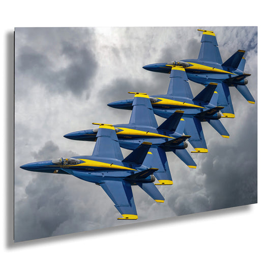 a group of fighter jets flying through a cloudy sky