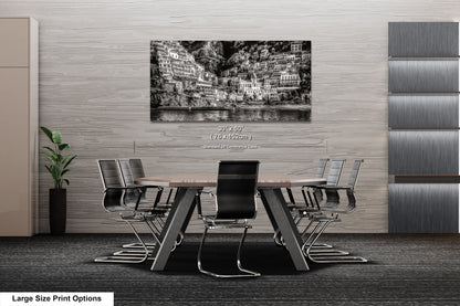 a black and white photo of a table and chairs