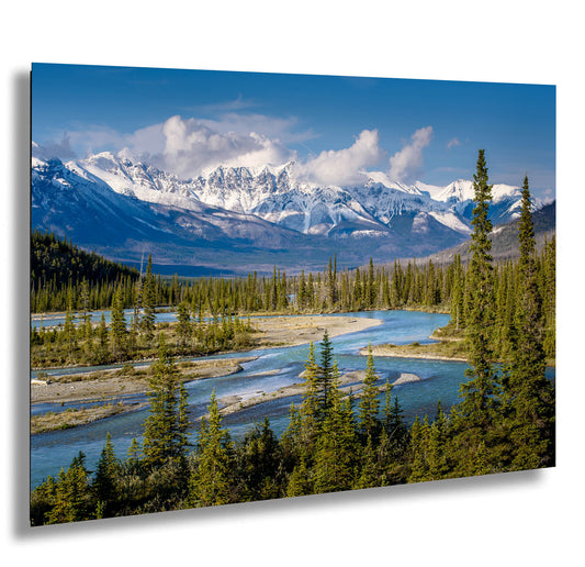 a scenic view of a mountain range with a river in the foreground