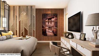 a bed room with a neatly made bed and a flat screen tv