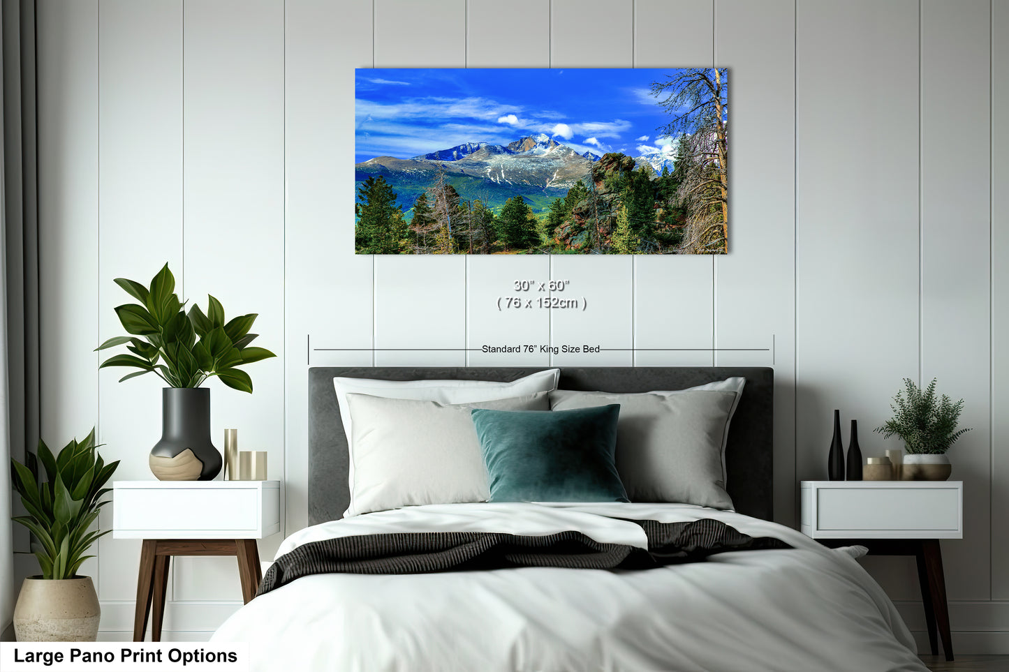 a bedroom with a large bed and a mountain view