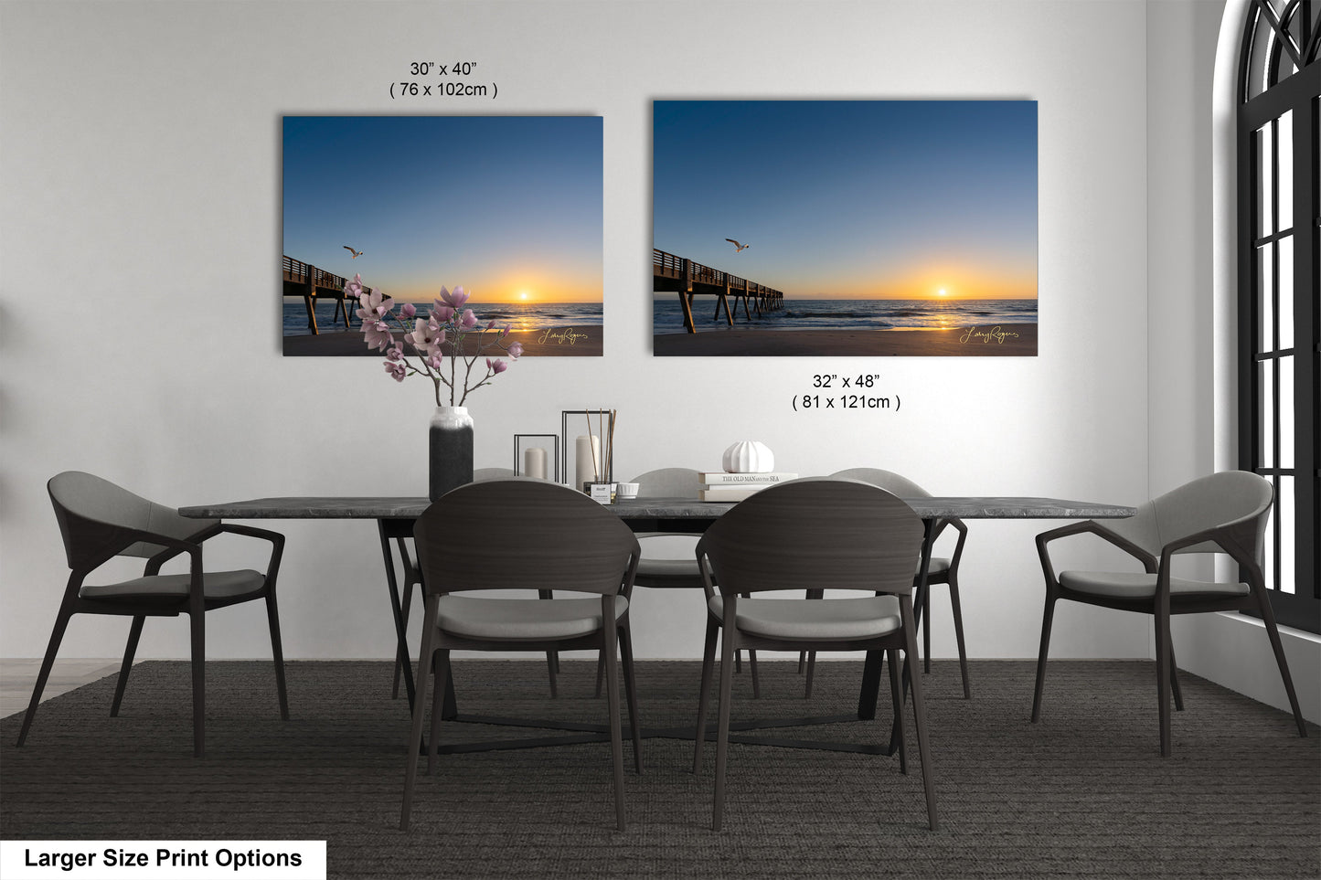 a dining room table with chairs and a vase of flowers