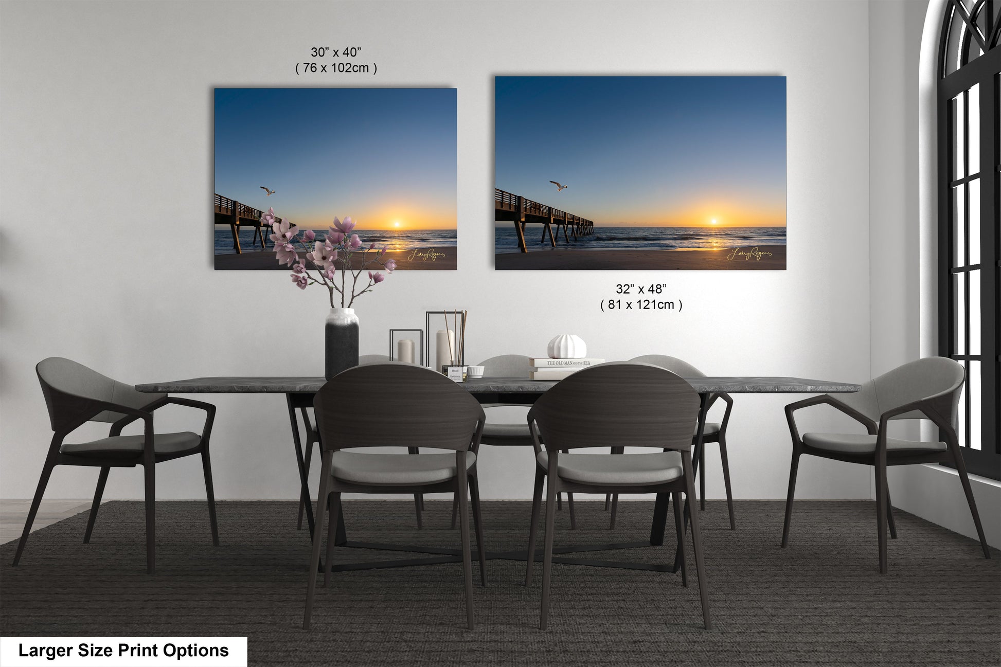 a dining room table with chairs and a vase of flowers