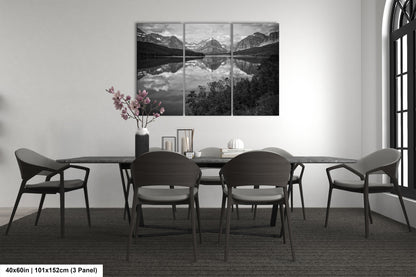 a black and white photo of a dining room table