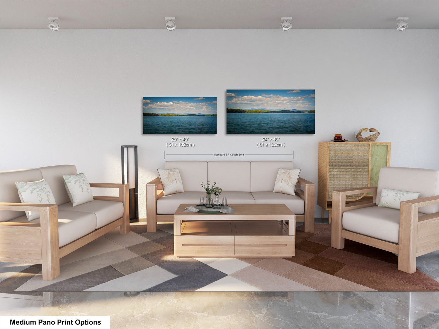 a modern living room with a sofa, two chairs, and a coffee table. The furniture is made of wood and has a neutral color scheme. There are two framed landscape paintings on the wall above the seating area, depicting a serene beach scene. The room has a clean, minimalist design with white walls and a gray floor.