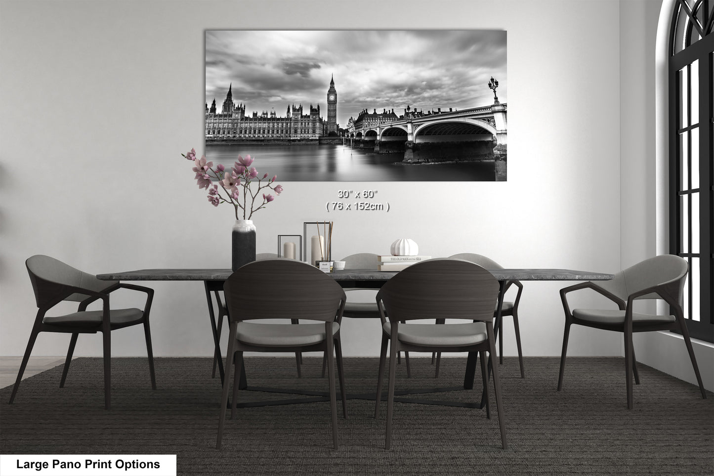 a black and white photo of a table and chairs