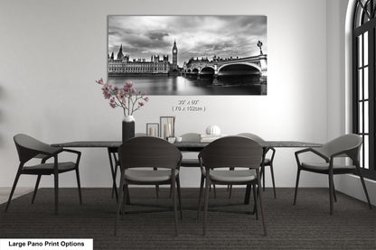a black and white photo of a table and chairs