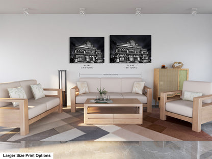 a living room with two pictures on the wall