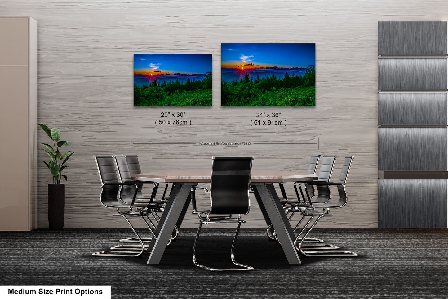 a dining room table with four chairs and two pictures on the wall