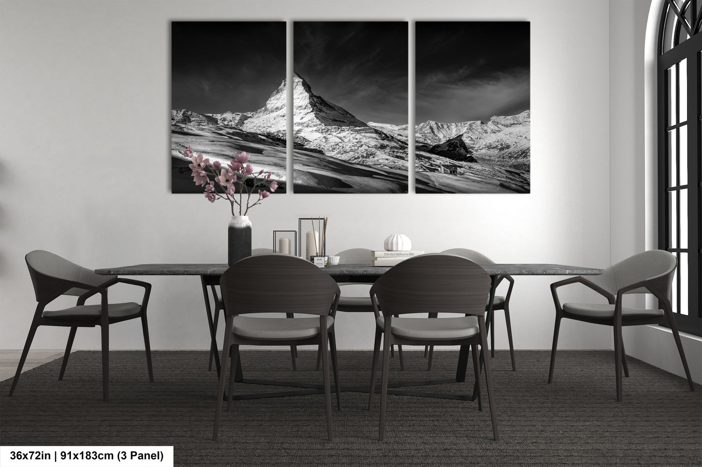 a black and white photo of a dining room table