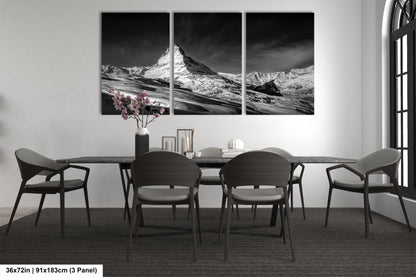 a black and white photo of a dining room table