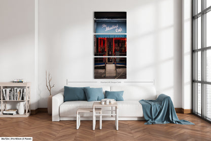 a white couch sitting in a living room next to a window
