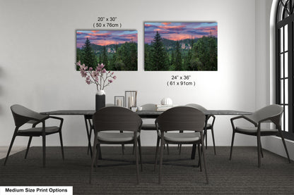 a dining room table with chairs and a vase of flowers