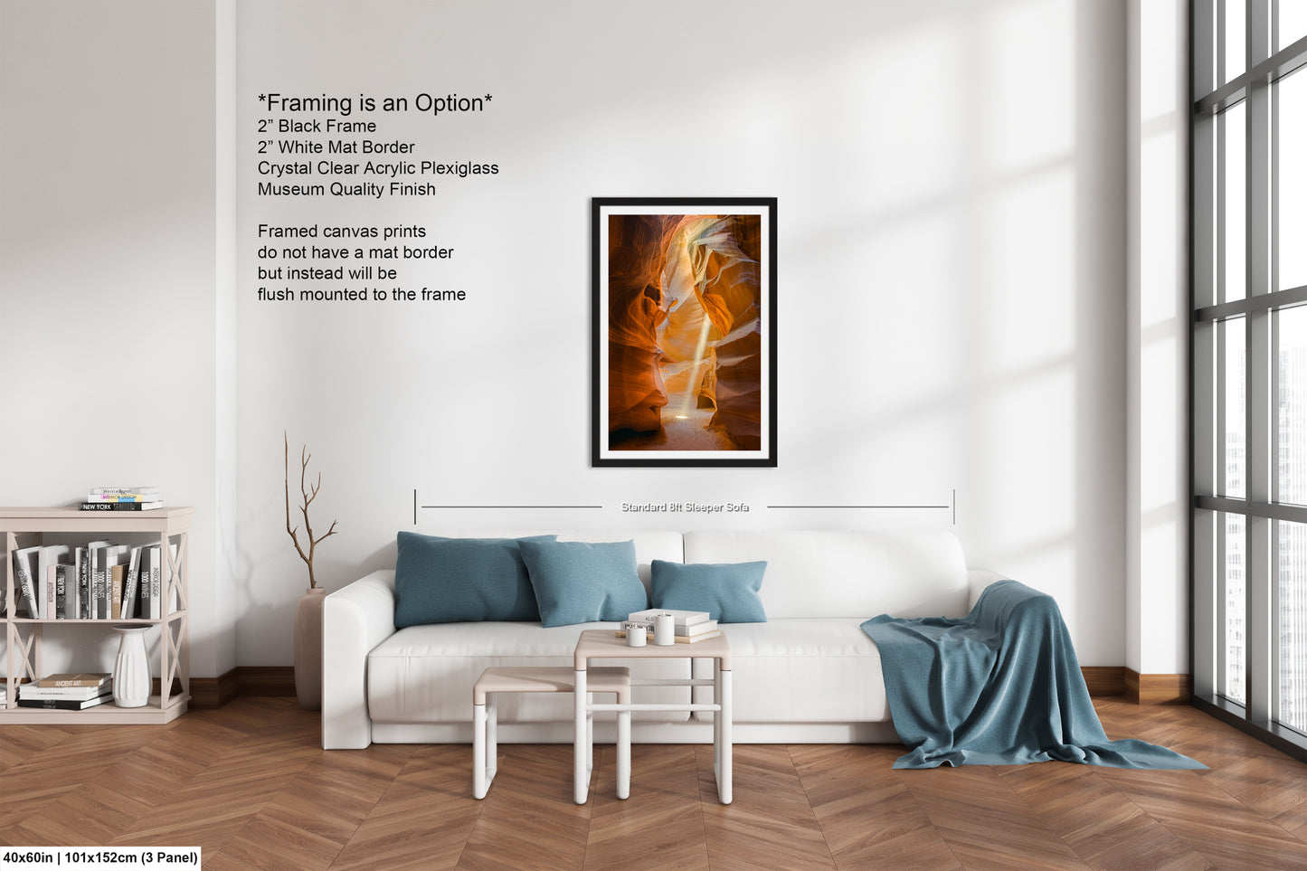 a living room with a white couch and a painting on the wall