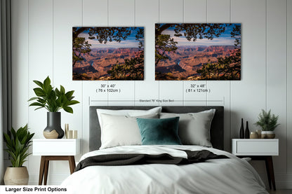 a bedroom with a bed and two pictures on the wall