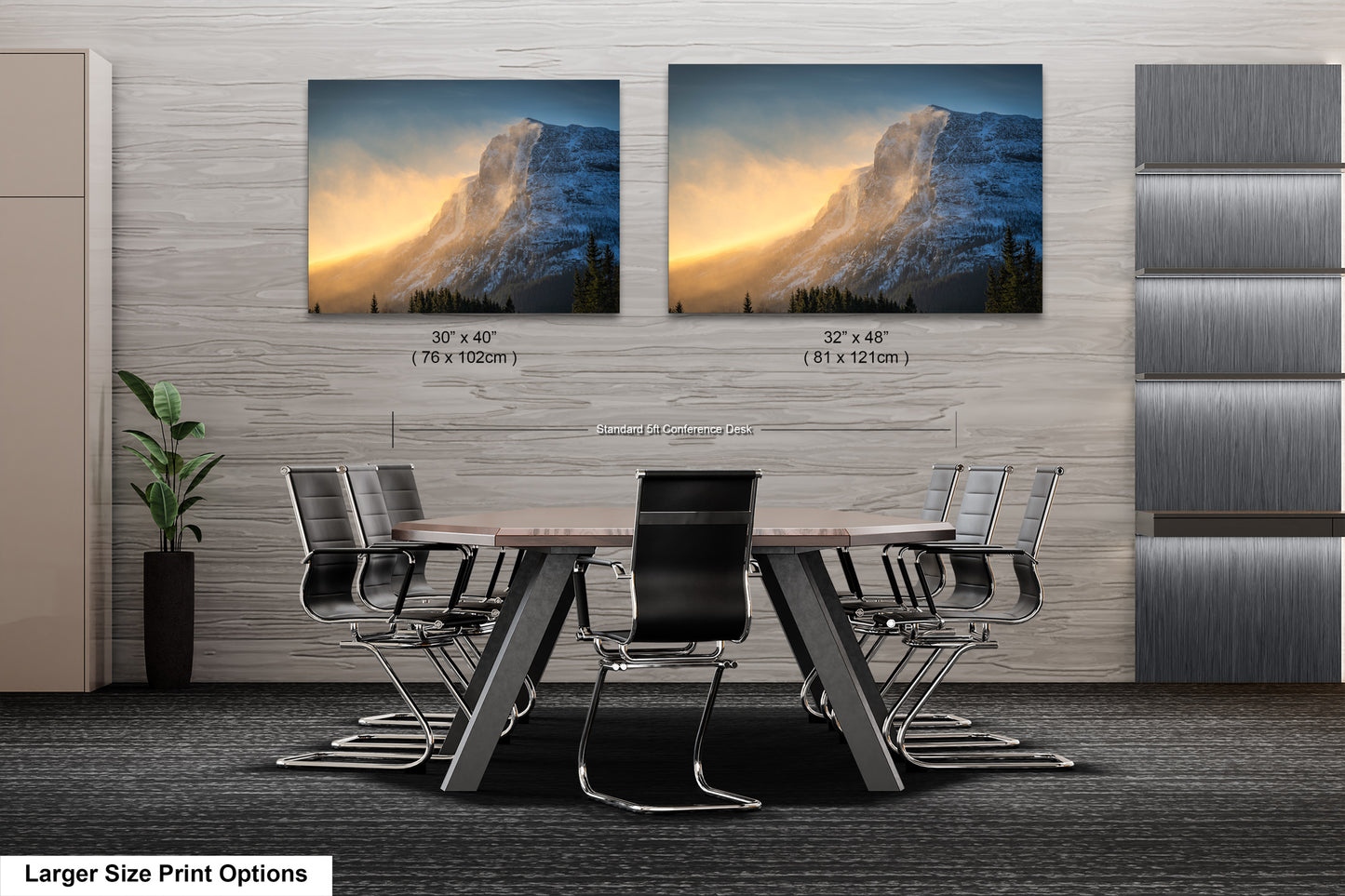 a dining room table with chairs in front of two pictures of a mountain