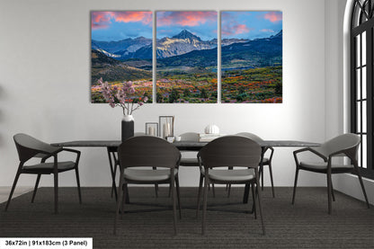 a dining room with a table and chairs