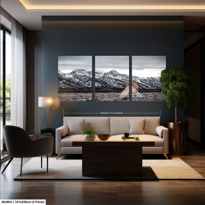 a living room filled with furniture and a painting on the wall