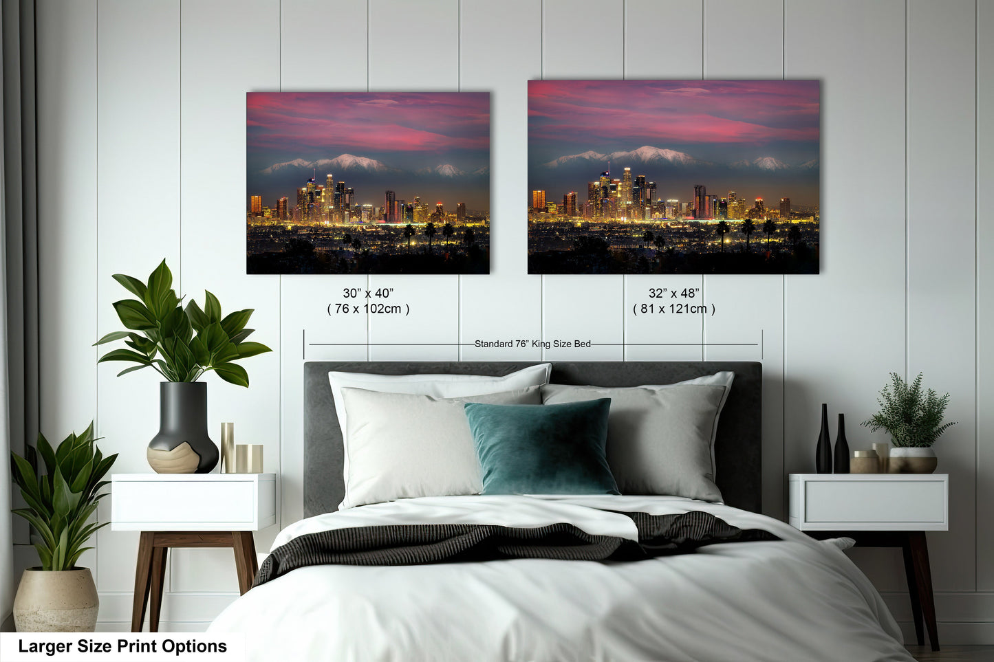 a bed with two pictures of a city in the background