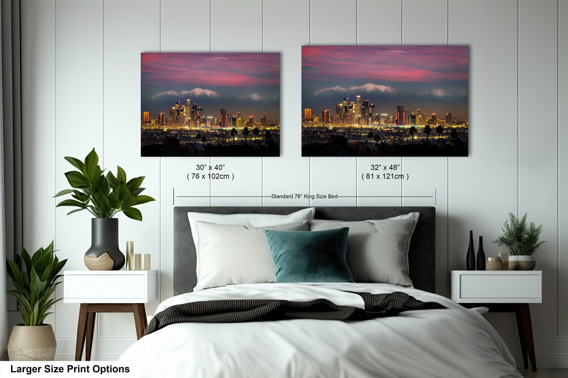 a bed with two pictures of a city in the background