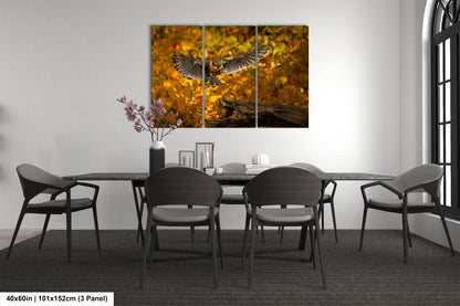 a dining room table with chairs and a painting on the wall