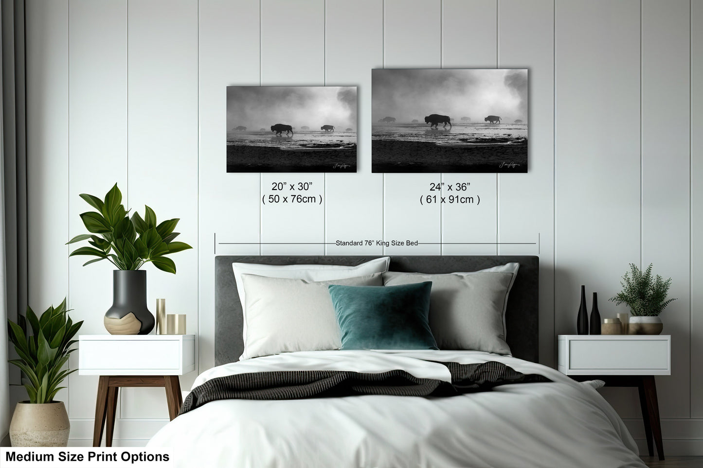 a bed with two pictures on the wall above it