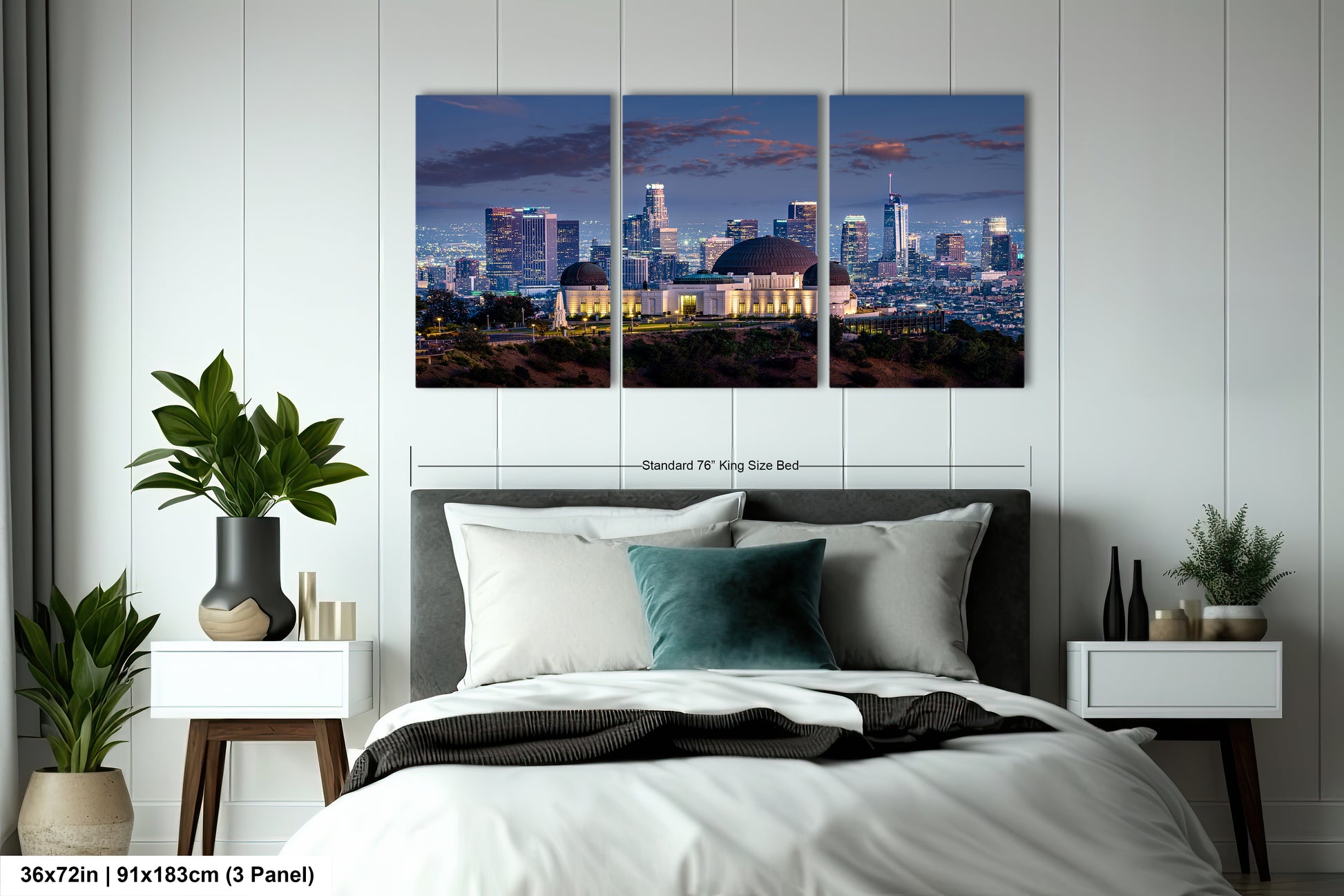 a bedroom with a bed and two paintings on the wall