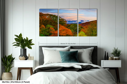 a bedroom scene with a bed and two paintings on the wall