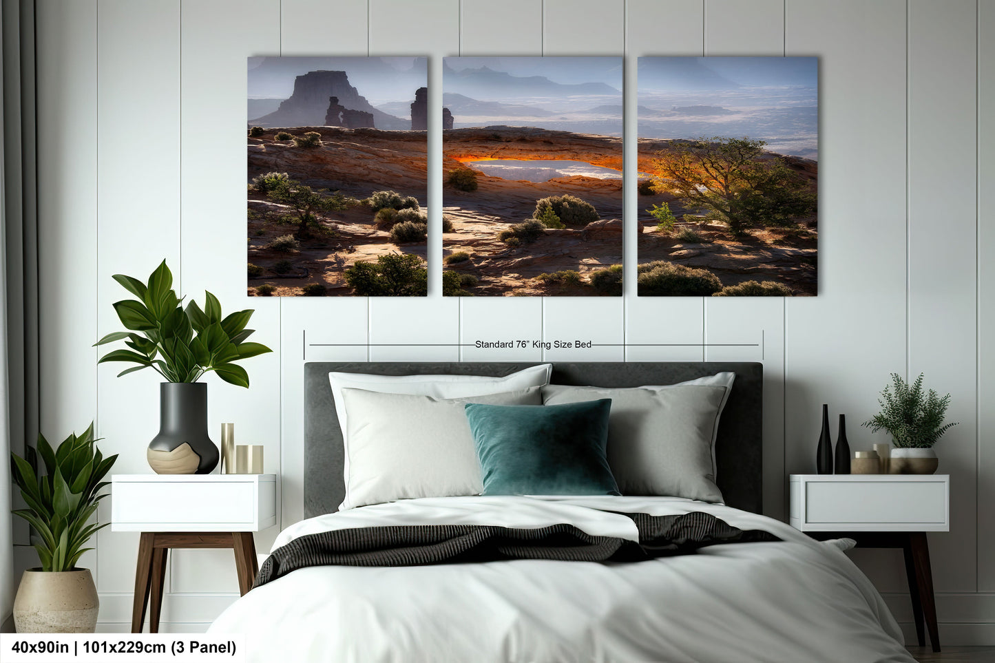 a bedroom with a bed and two paintings on the wall