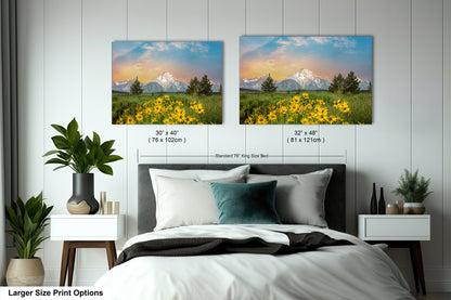 a bedroom with a bed and two pictures on the wall