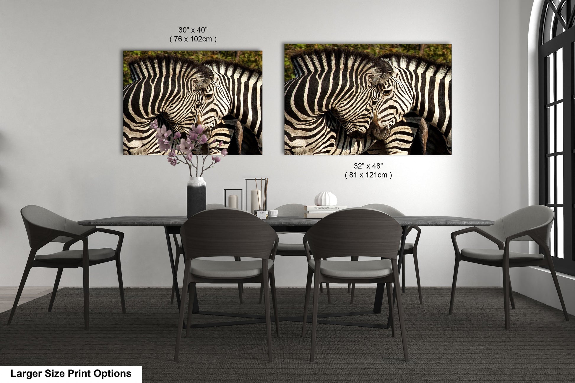 a couple of zebras standing next to each other