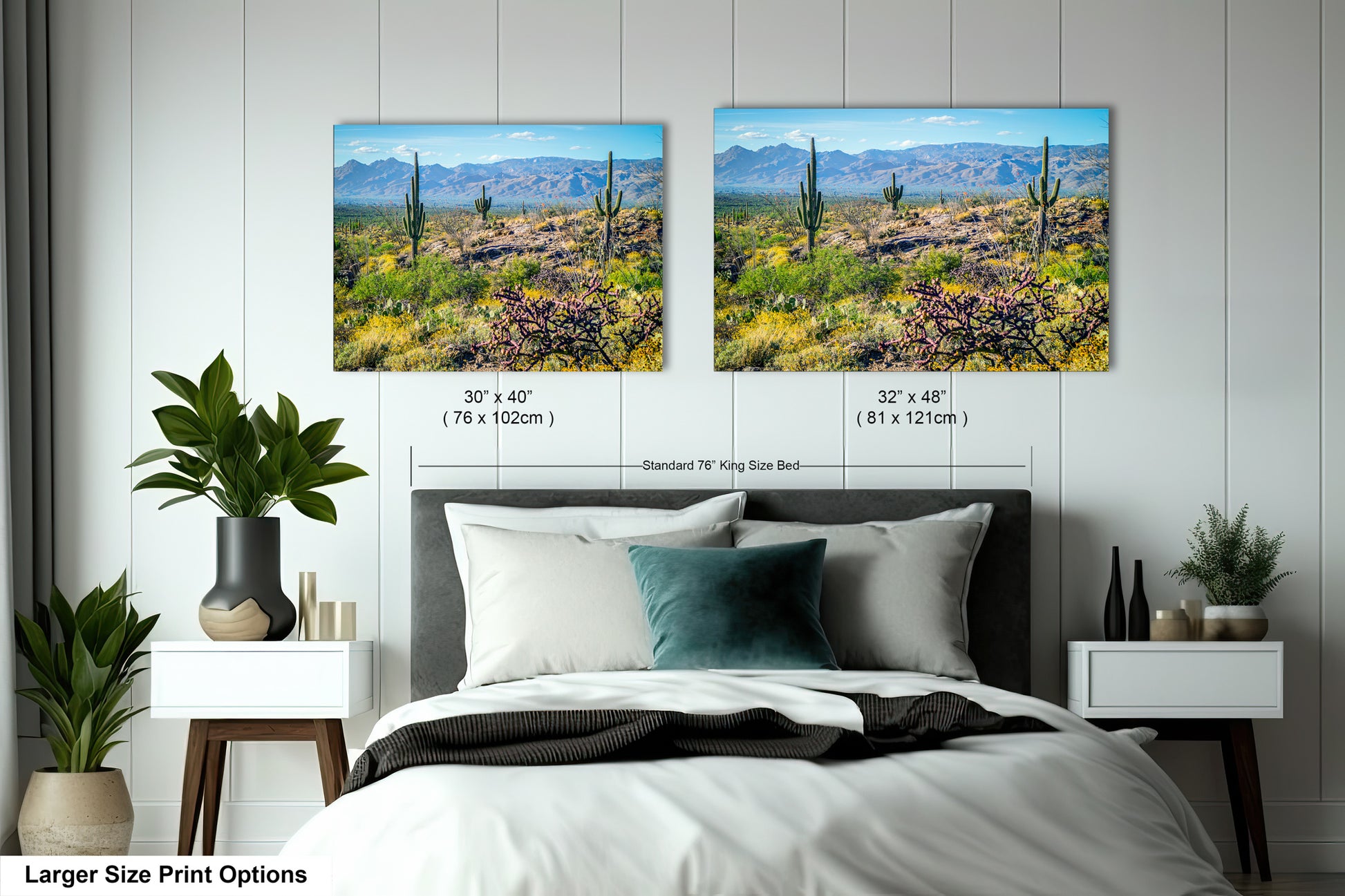 a bedroom with two framed landscape photographs hanging on the wall above a bed. The photographs depict a desert scene with mountains in the background.