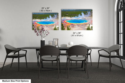 a dining room table with four chairs and a vase of flowers